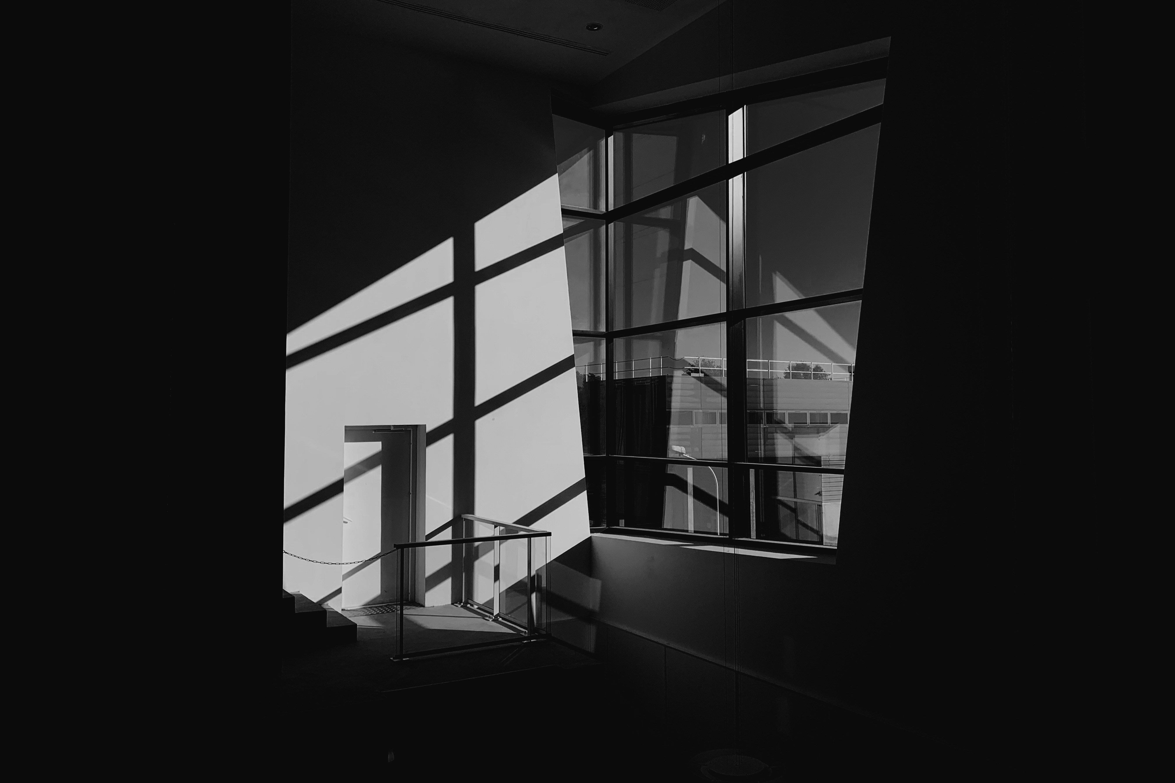 Greyscale photo of glass window